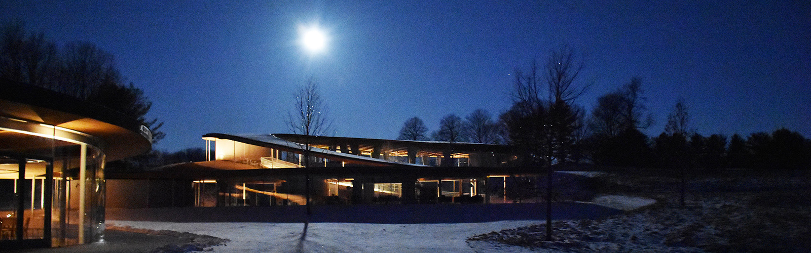Winter full moon over the River building at Grace Farms